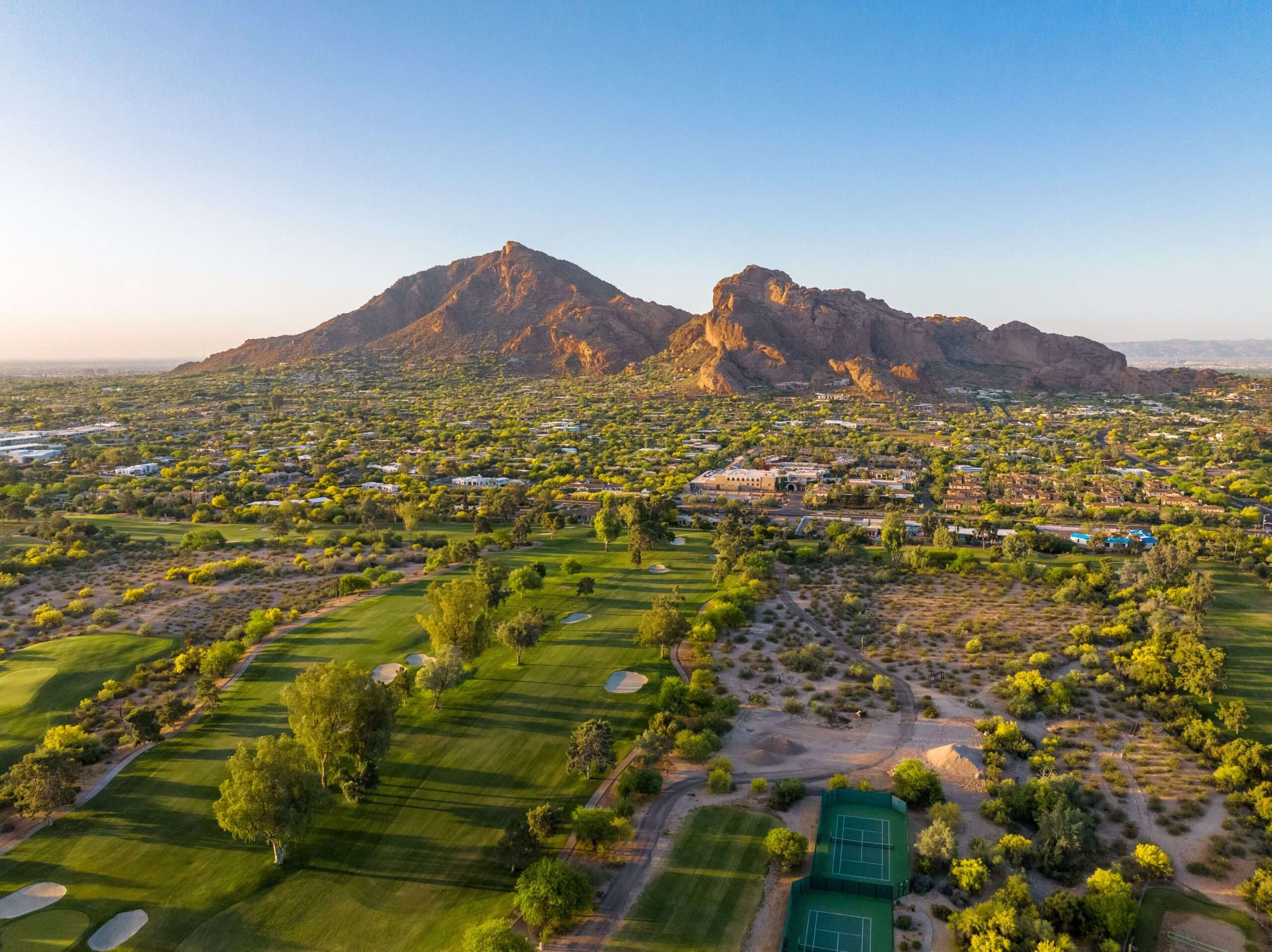 Camelback Mountain at sunrise in Phoenix, Arizona golf course and luxury homes